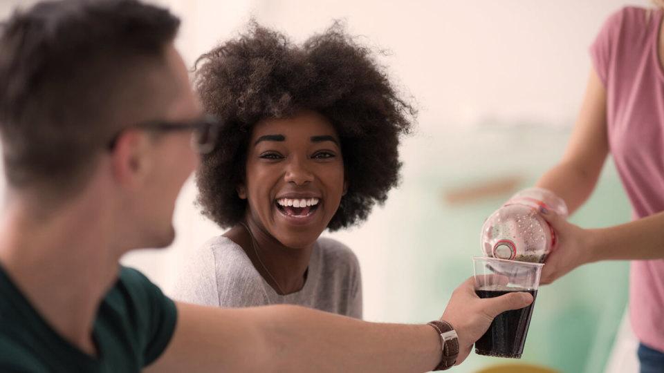 group of young people having a beverage