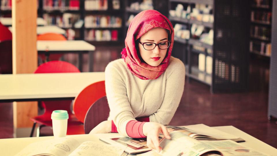 Young woman studying in library