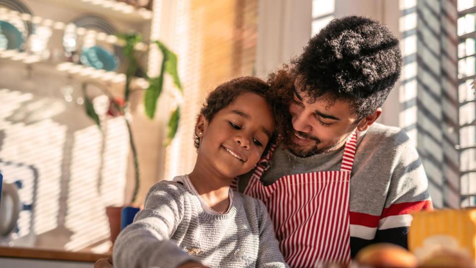 Father and daughter spending time together cooking