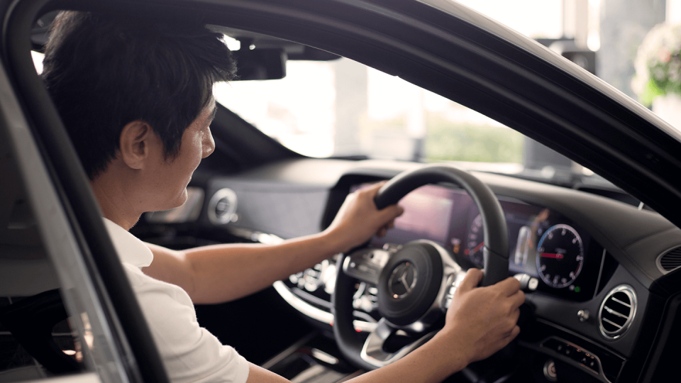 Man sitting in Mercedes