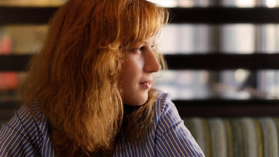 Young woman looking off to one side