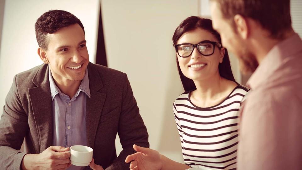 3 people talking over coffee