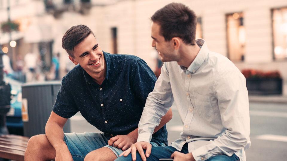 Two men talking in the street