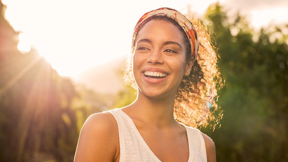 Relaxed woman smiling in garden